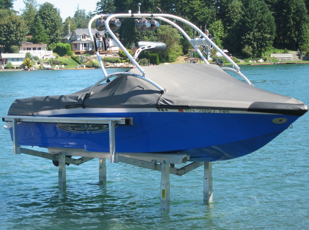 A sturdy boatlift securely holding a boat above the water, showcasing the reliable and durable construction of the lift system.
